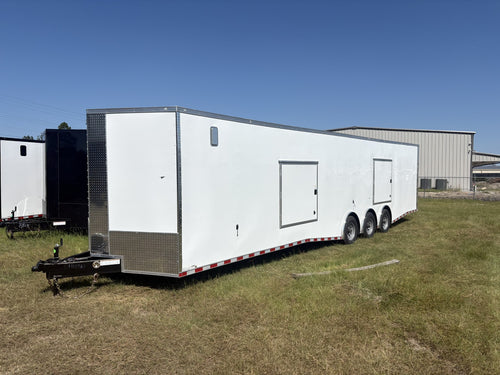 This Rock Solid Cargo trailer is set up with triple 7,000 lb torsion axles, spread axle configuration, E-Track, escape doors, D-rings, and more — a great setup for hauling cars, race vehicles, equipment, and more!