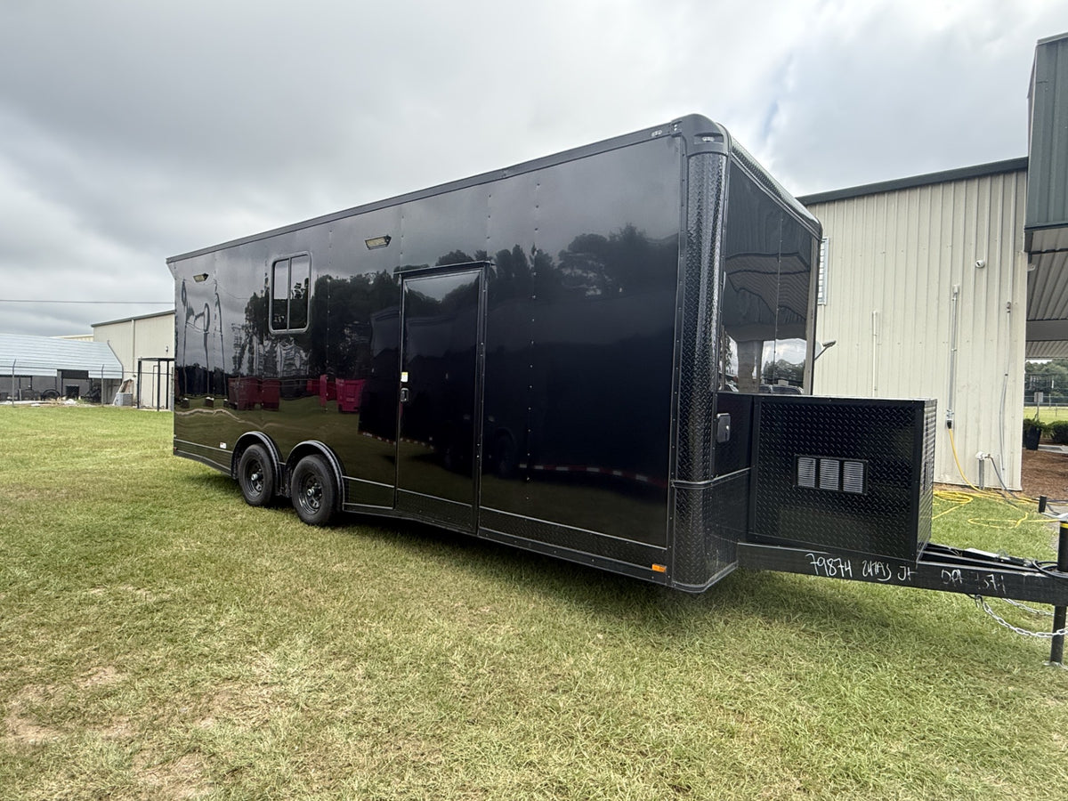 This 8.5x24TA3 Black Race Ready Trailer is a fully finished, insulated triple-axle hauler featuring an 8' interior height, full bathroom, 50 AMP electrical package, generator box, and plenty of room for race cars, motorcycles, and motorsports equipment.