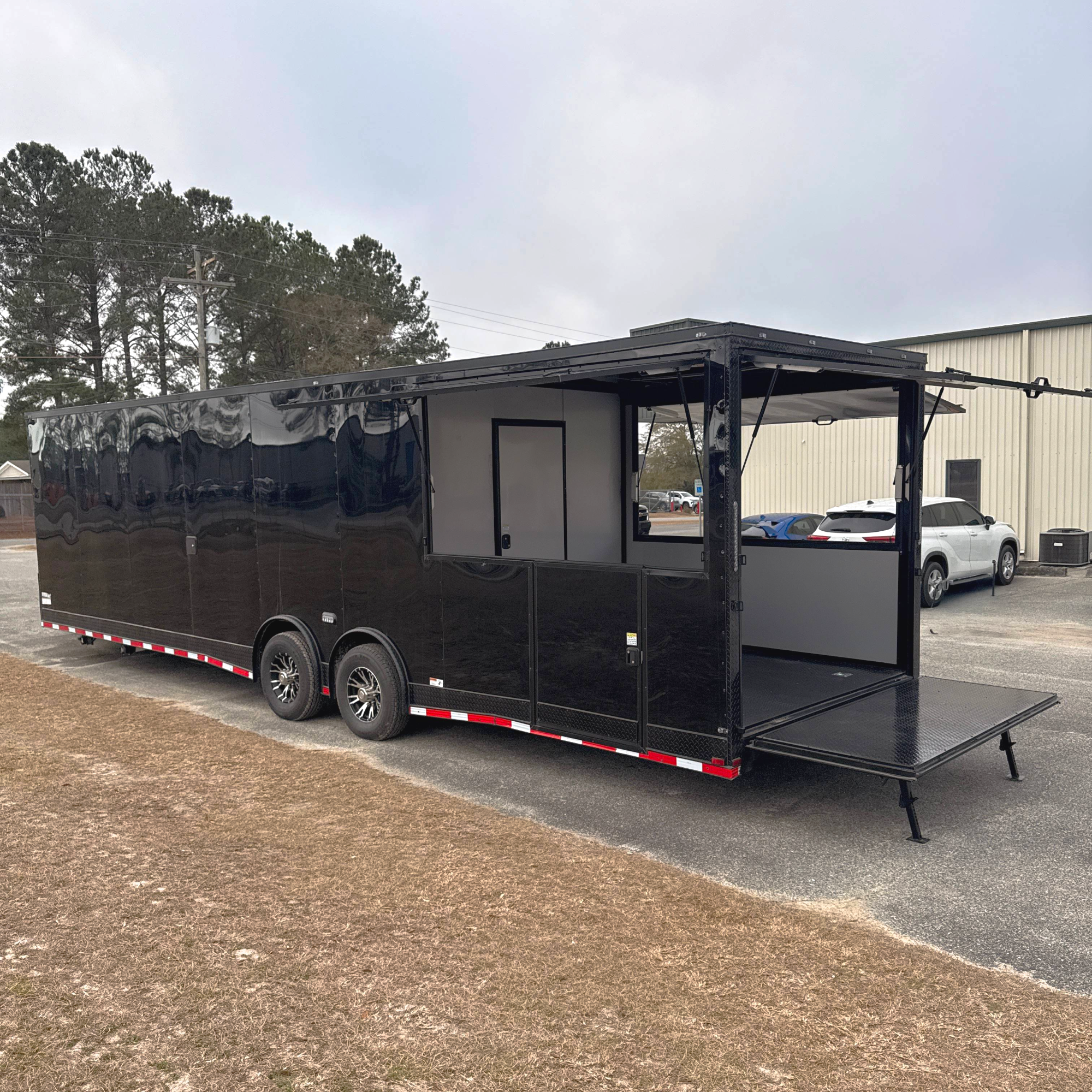 8.5X32TA5 Black Gullwing Porch Trailer