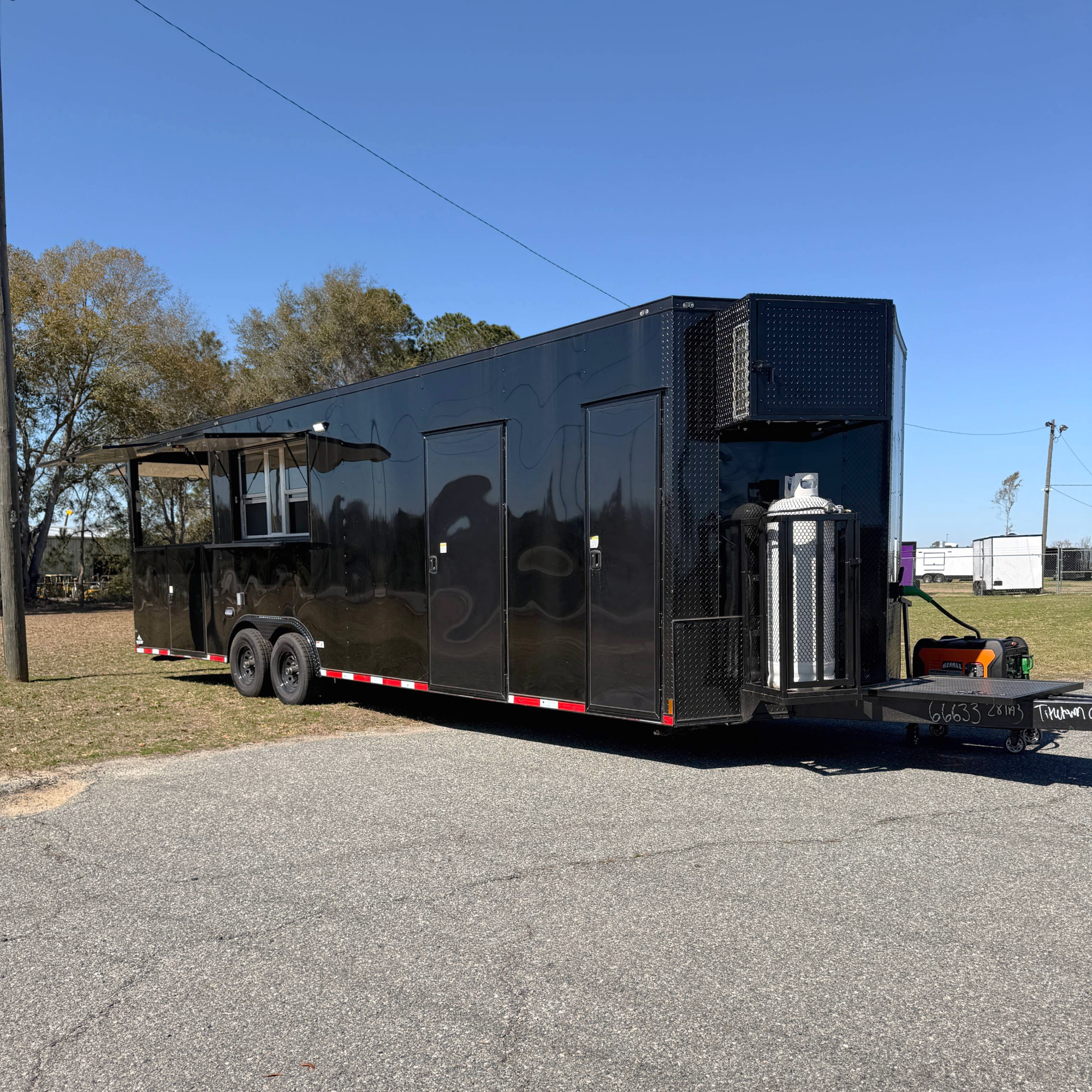 8.5X28TA3 Black Concession Gullwing Porch Trailer